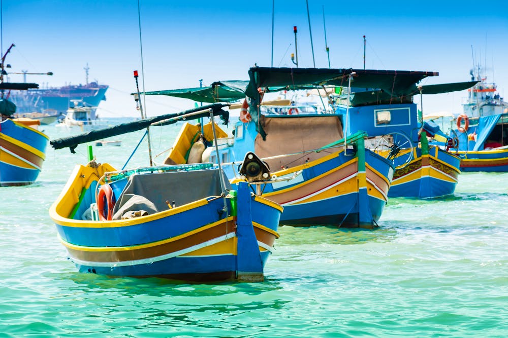 Fischerboote in Marsaxlokk - Malta &ndash; &copy; digitalsignal - Adobe Stock