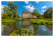 Schlosssee mit Schloss Branitz – © StG Stockfoto – Adobe Stock