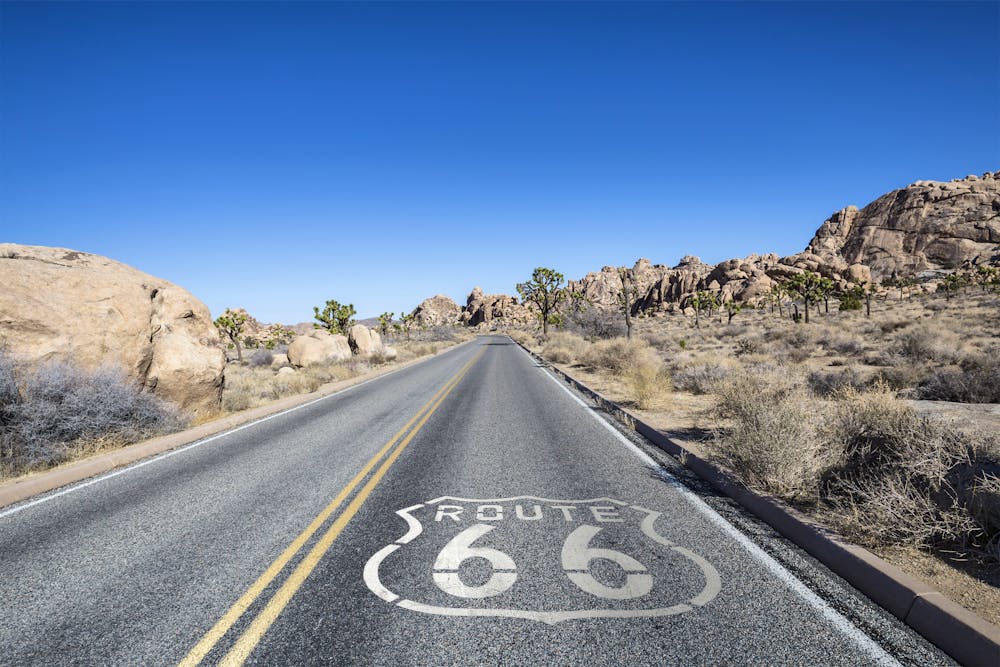 California – Highway with Route 66 Sign in Joshua Tree Desert &ndash; &copy; trekandphoto - stock.adobe.com