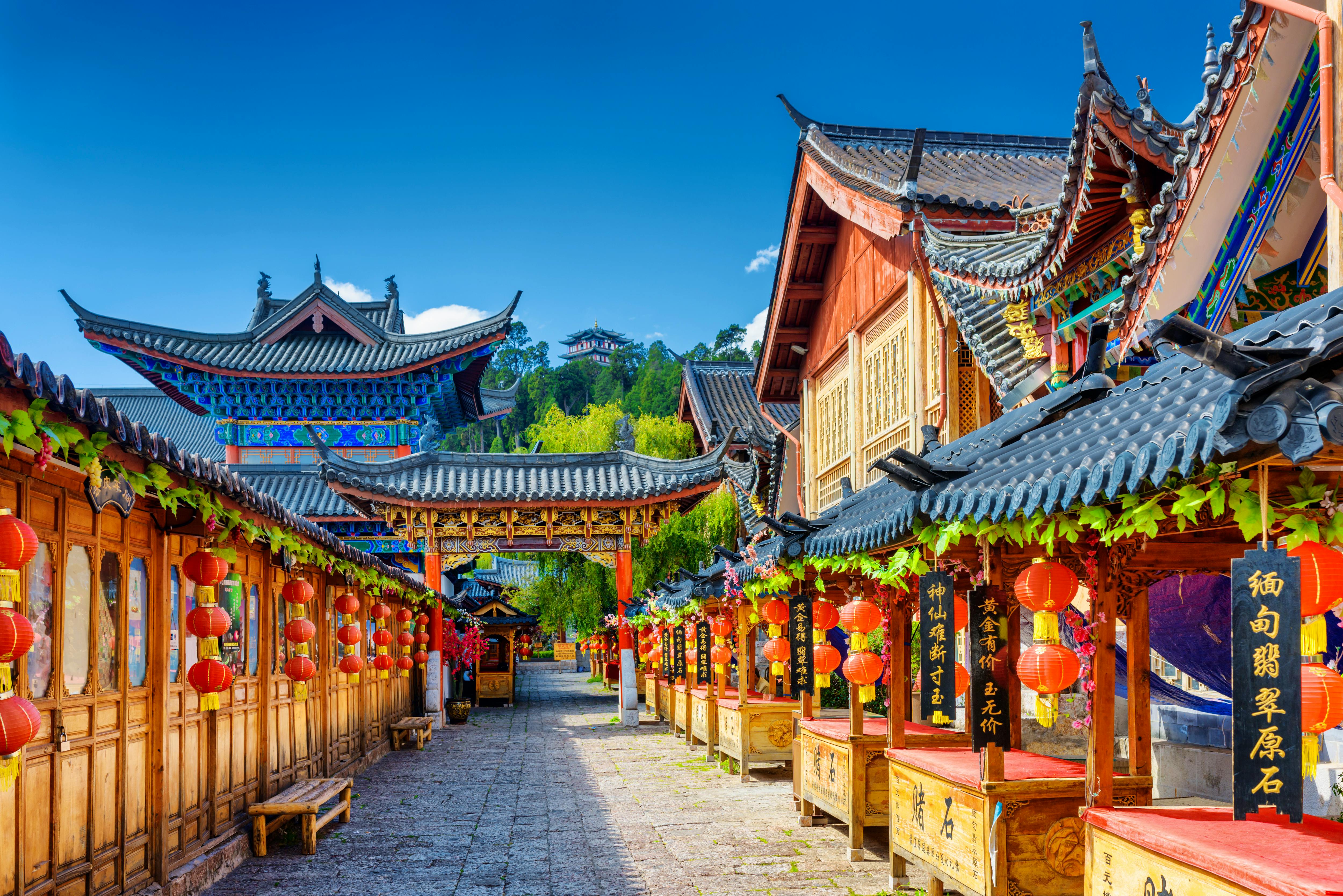 LIJIANG  YUNNAN PROVINCE  CHINA - OCTOBER 23  2015  Ancient street decorated with traditional Chinese red lanterns in the Old Town of Lijiang  Lijiang is a popular tourist destination of Asia  &copy; efired - Fotolia