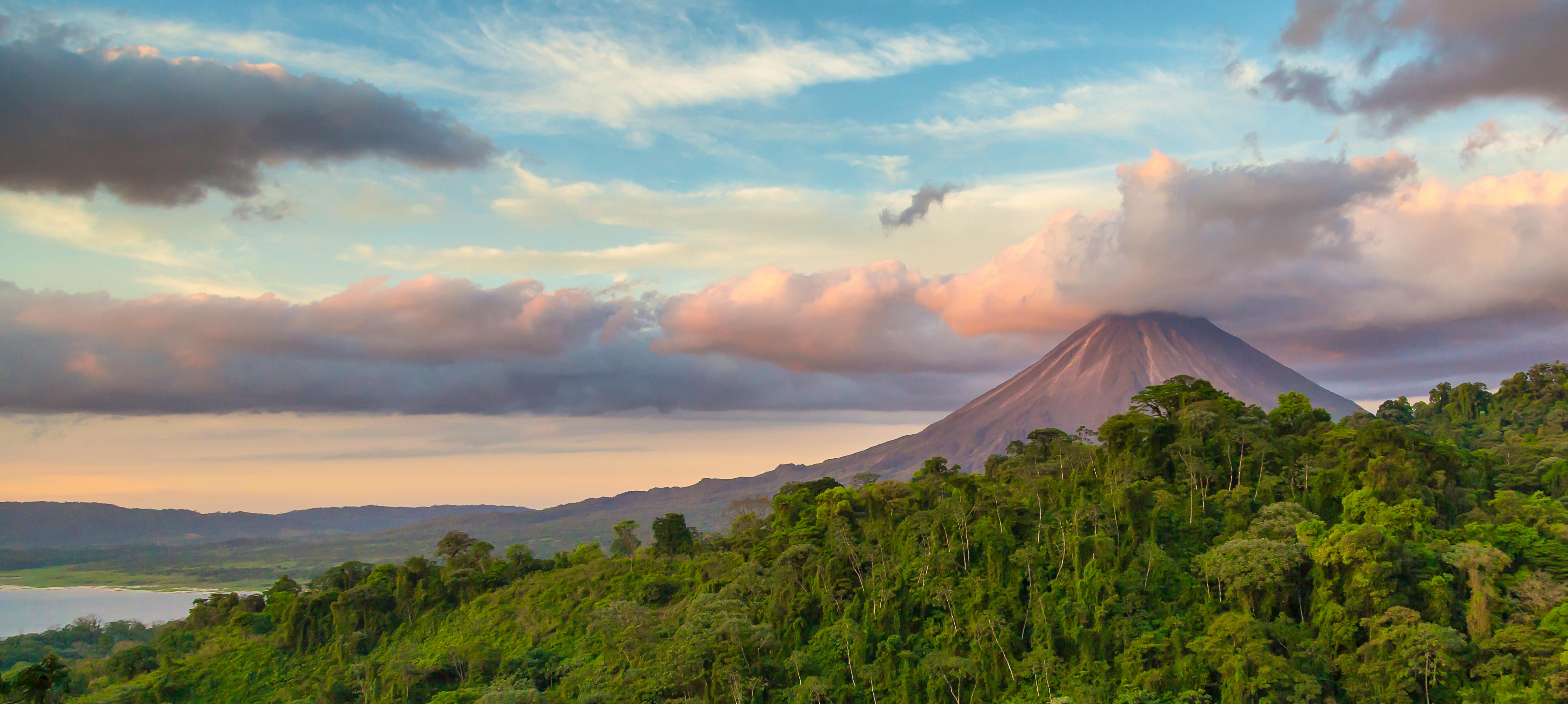 Arenal Volcano at Sunrise in Costa Rica, as the sun reflects on the newly formed clouds &copy; contact Huenink for permission  or sale