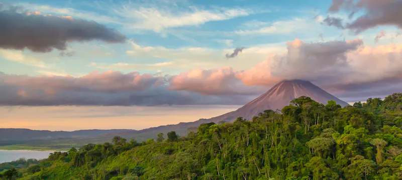 Arenal Volcano at Sunrise in Costa Rica, as the sun reflects on the newly formed clouds - &copy;contact Huenink for permission  or sale