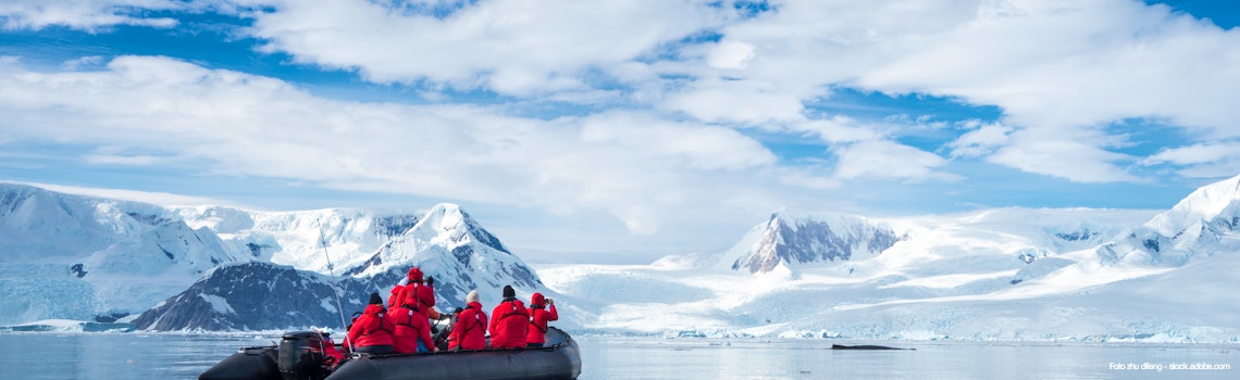Inflatable boat full of tourists  watching for whales and seals  Antarctic Peninsula  Antarctica – © zhu difeng - stock.adobe.com