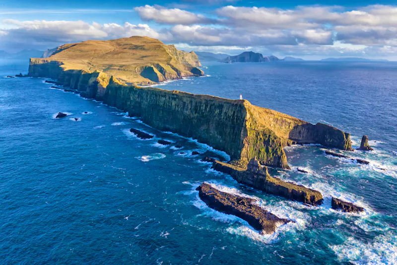 Mykines Cliffs and Lighthouse - &copy;pics721 - stock.adobe.com